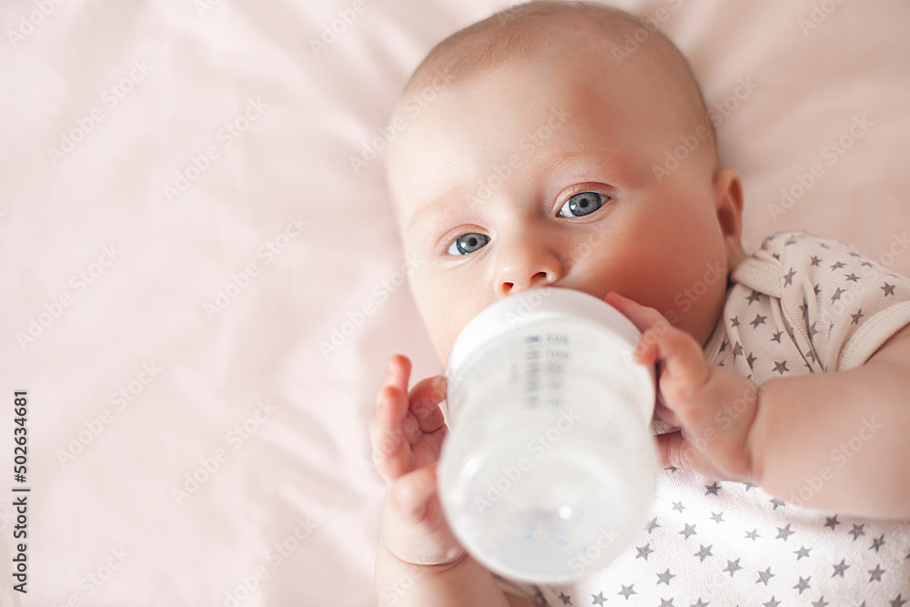Little cute baby eating formula. Infant feedeng Little cute baby eating formula. Infant feedeng