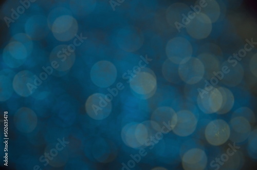 Festive background. Blue background with bokeh. Blurred background. Abstraction circles.