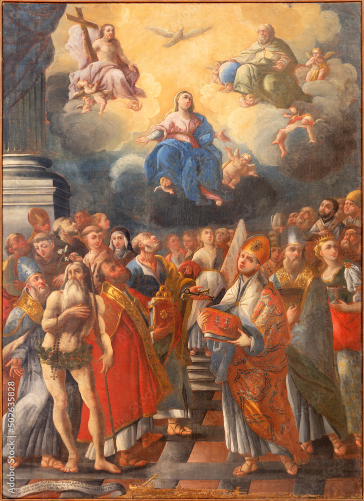 MONOPOLI, ITALY - MARCH 6, 2022: The painting of Madonna, Holy Trinity and the saints in church Santa Theresia by Gianbattista Lama (1711).