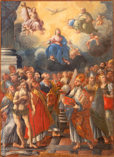 MONOPOLI, ITALY - MARCH 6, 2022: The painting of Madonna, Holy Trinity and the saints in church Santa Theresia by Gianbattista Lama (1711).