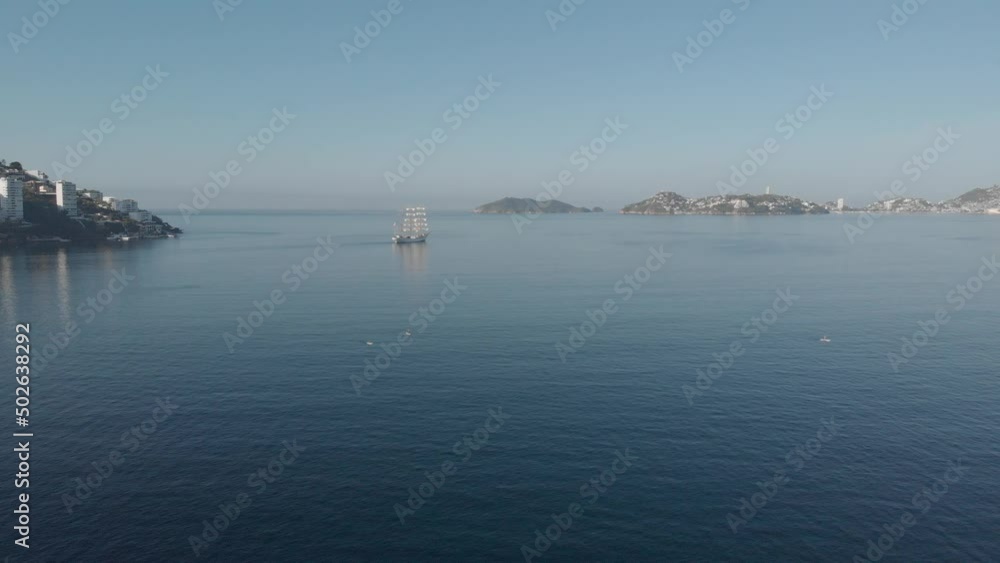 Beautiful view of the beach, aerial view of the beach, acapulco beach seen from above. Travel and vacation concept. Colorful sunset on the beach. Aerial video
