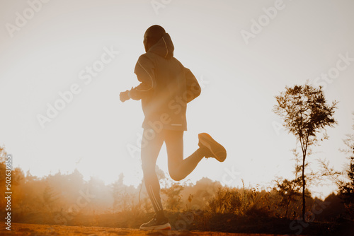 Εκτύπωση καμβά Silhouette of a kenyan runner running along a red dirt road near the city of Iten in Kenya