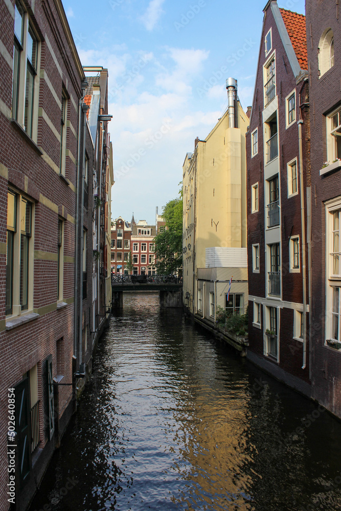 channel in the city and houses