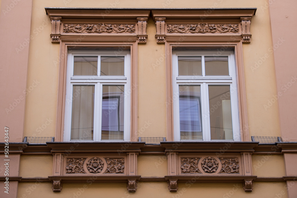 Munich, Germany - May 01, 2022: Old Decorative Wooden window. Munich, Germany - May 01, 2022: Old Decorative Wooden window.