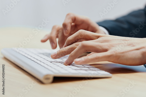 man sitting at a desk in front of a computer emotions Workspace © SHOTPRIME STUDIO
