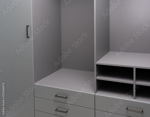 Apartment interior with modern design. Part of room interior, closet with empty shelves