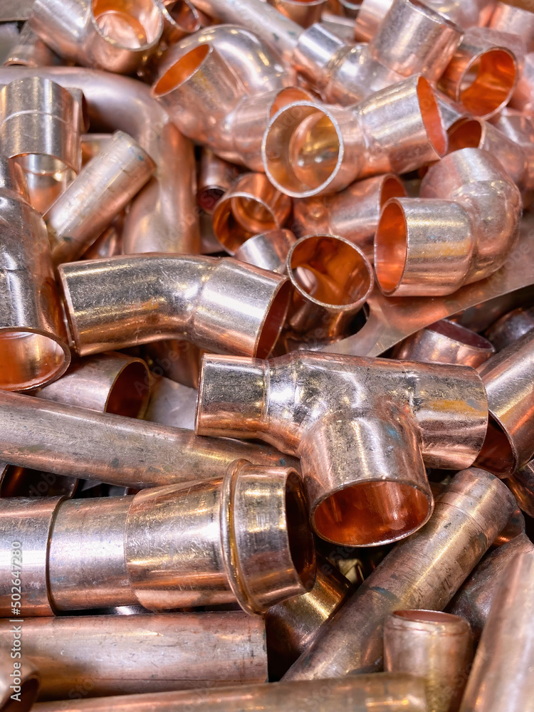 Copper tubes and elbows used by plumbers for water and gas installation Copper tubes and elbows used by plumbers for water and gas installation