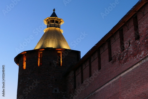 Nizhny Novgorod Kremlin. Tainitskaya tower, round tower of the Nizhny Novgorod Kremlin illuminated in the evening. photo