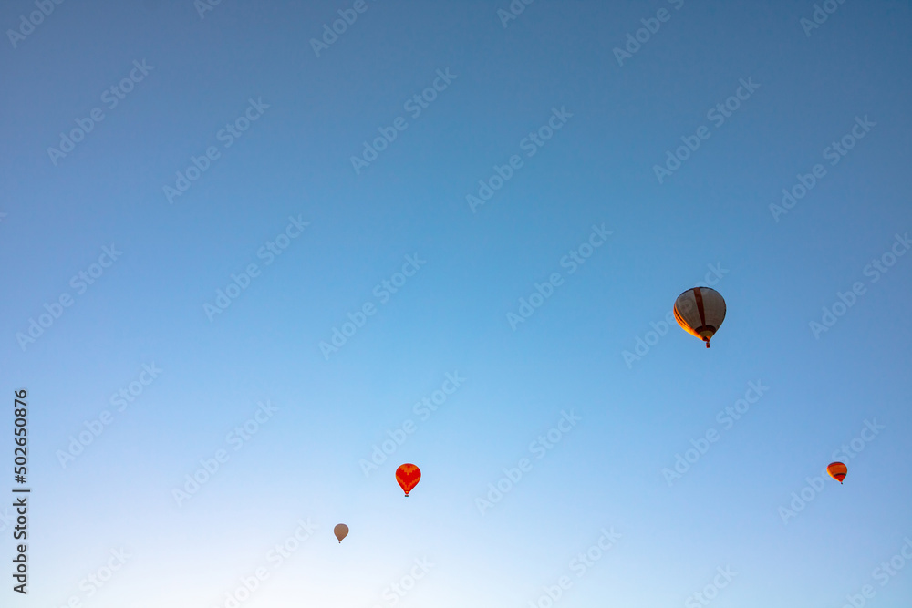 Hot air balloons on the sky in the morning. Ballooning activity Hot air balloons on the sky in the morning. Ballooning activity