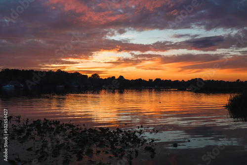 Sunset over the river. river landscape. Sunset with reflection on the water