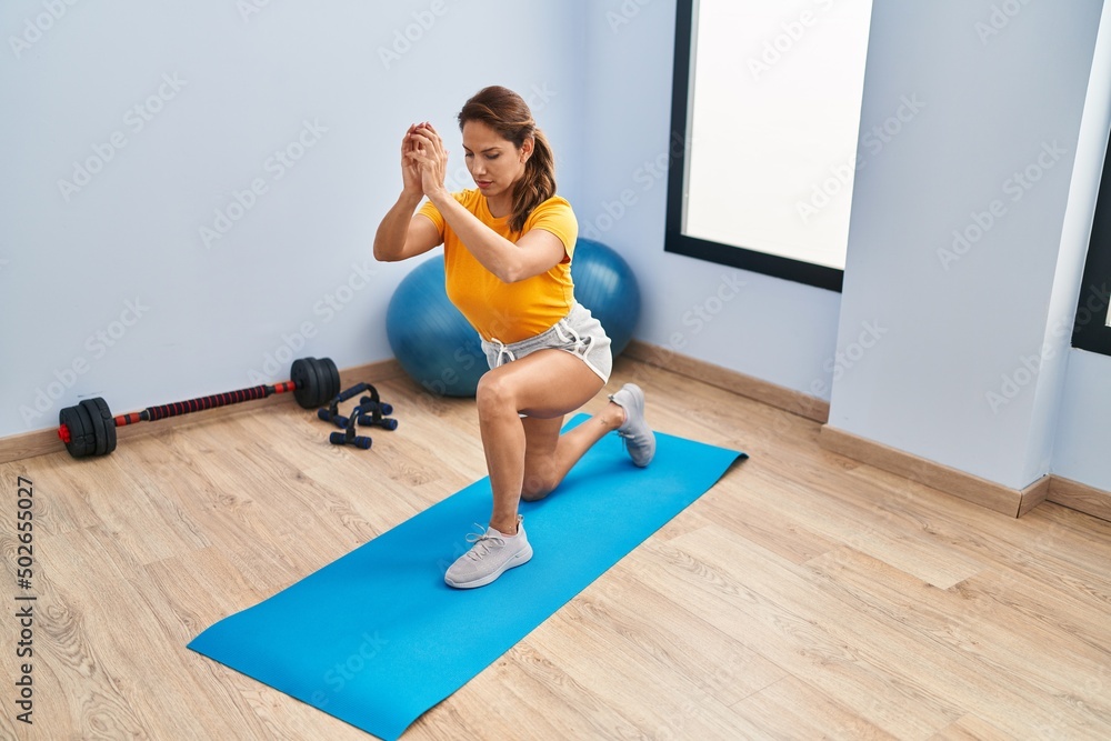 Young latin woman training at sport center Young latin woman training at sport center