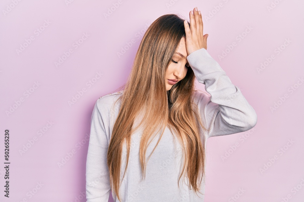 Young blonde girl wearing casual clothes surprised with hand on head for mistake, remember error. forgot, bad memory concept. Young blonde girl wearing casual clothes surprised with hand on head for mistake, remember error. forgot, bad memory concept.
