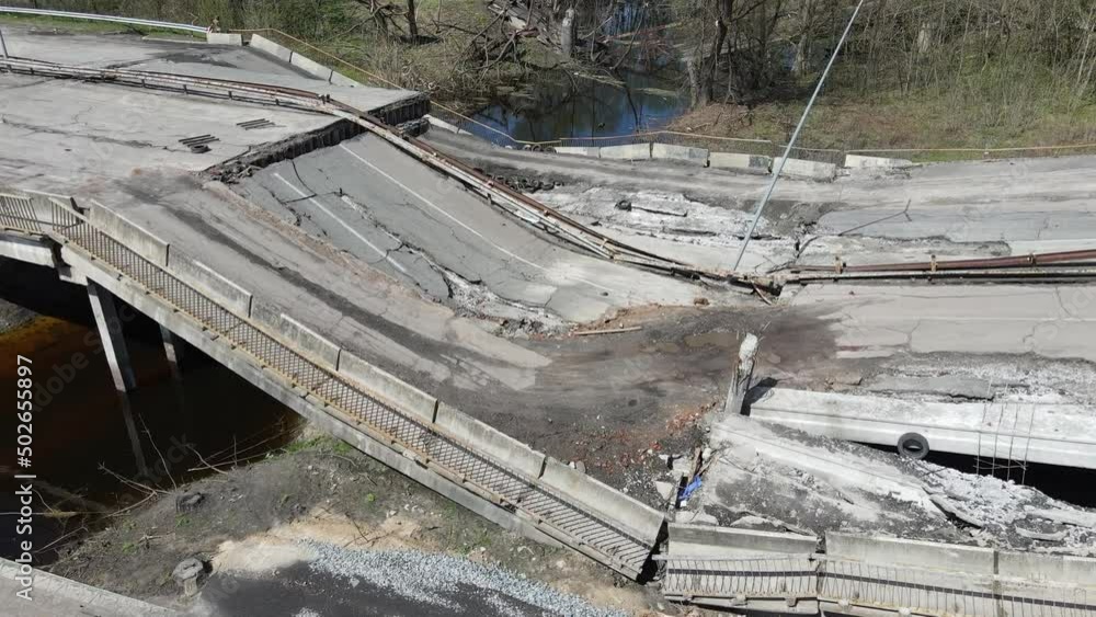 Chernihiv, Ukraine - 27.04.2022: War in Ukraine. Chaos and devastation on the outskirts of Chernihiv. Blown up bridge as a result of rocket fire and shelling of a peaceful city Chernihiv, Ukraine - 27.04.2022: War in Ukraine. Chaos and devastation on the outskirts of Chernihiv. Blown up bridge as a result of rocket fire and shelling of a peaceful city
