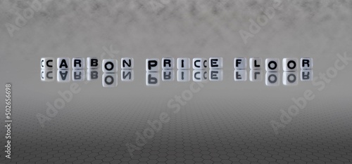 carbon price floor word or concept represented by black and white letter cubes on a grey horizon background stretching to infinity