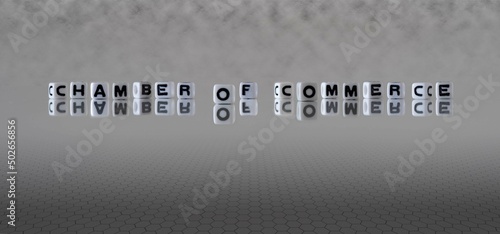 chamber of commerce word or concept represented by black and white letter cubes on a grey horizon background stretching to infinity