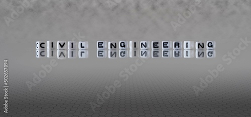 civil engineering word or concept represented by black and white letter cubes on a grey horizon background stretching to infinity