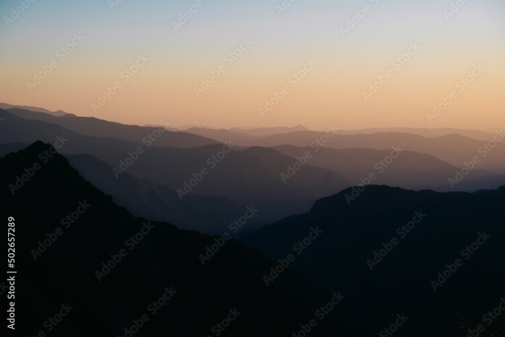 Background of soft shadows of the foggy mountains