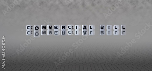 commercial bill word or concept represented by black and white letter cubes on a grey horizon background stretching to infinity
