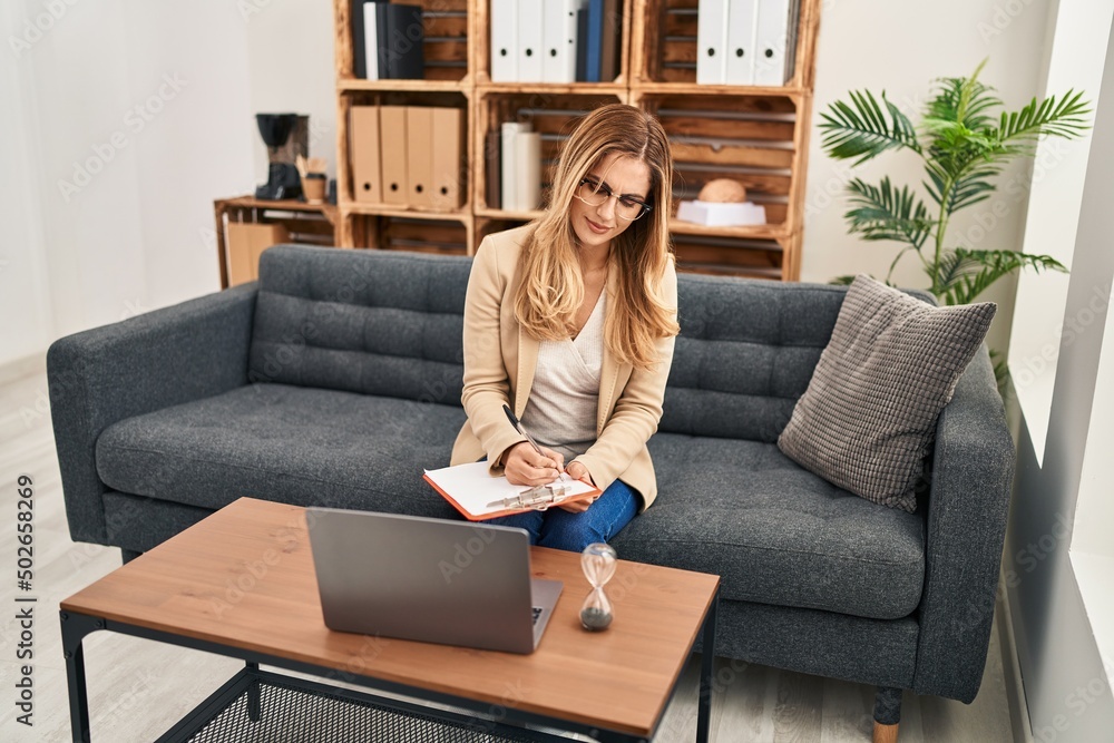Young blonde woman psychologist having teleconsultation at psychology center Young blonde woman psychologist having teleconsultation at psychology center