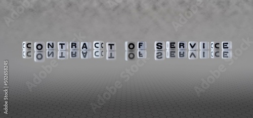 contract of service word or concept represented by black and white letter cubes on a grey horizon background stretching to infinity