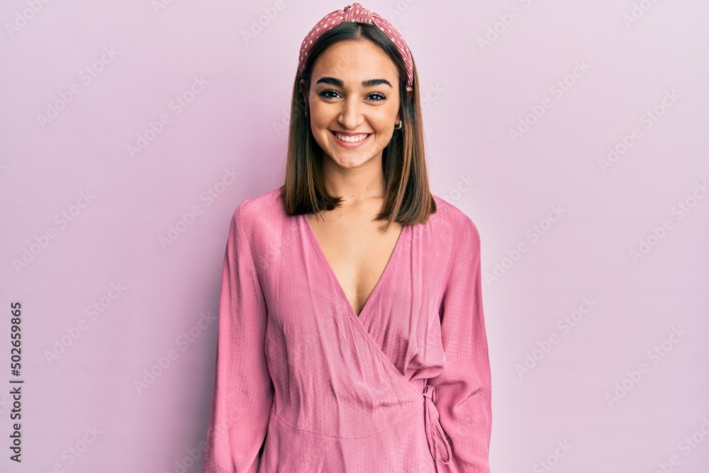 Young brunette girl wearing casual clothes with a happy and cool smile on face. lucky person. Young brunette girl wearing casual clothes with a happy and cool smile on face. lucky person.