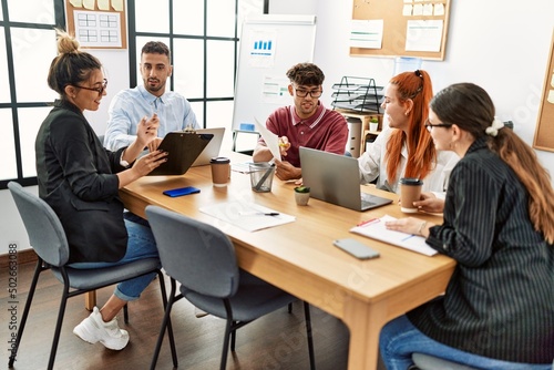 Group of business workers smiling happy working at the office