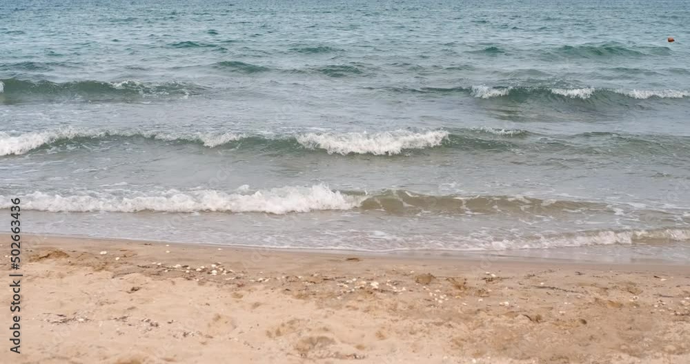 Devastating sea waves. A view of a stormy sea waves on the sandy beach in the morning. Devastating sea waves. A view of a stormy sea waves on the sandy beach in the morning.