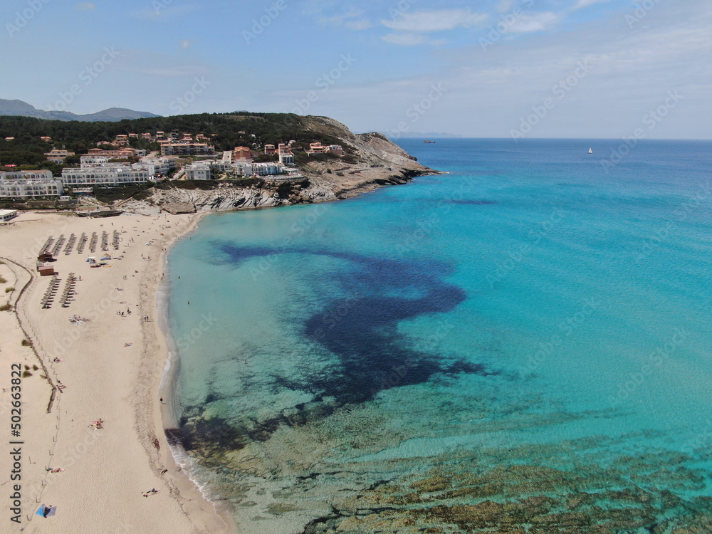 Fototapeta premium Cala Mesquida . Cala Ratjada Beautiful view of the seacoast of Majorca with an amazing turquoise sea, in the middle of the nature. Concept of summer, travel, relax and enjoy