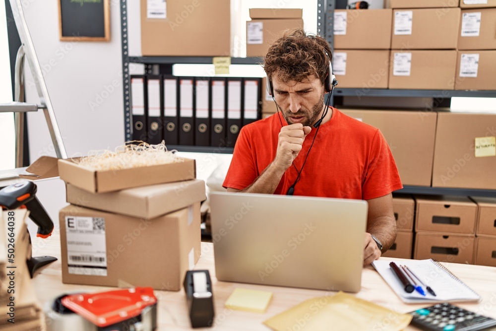 Young hispanic call center agent man working at warehouse feeling unwell and coughing as symptom for cold or bronchitis. health care concept. Young hispanic call center agent man working at warehouse feeling unwell and coughing as symptom for cold or bronchitis. health care concept.
