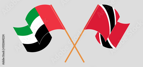 Crossed and waving flags of the United Arab Emirates and Trinidad and Tobago