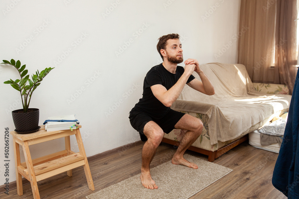 healthy man working out at home at his fitness healthy man working out at home at his fitness