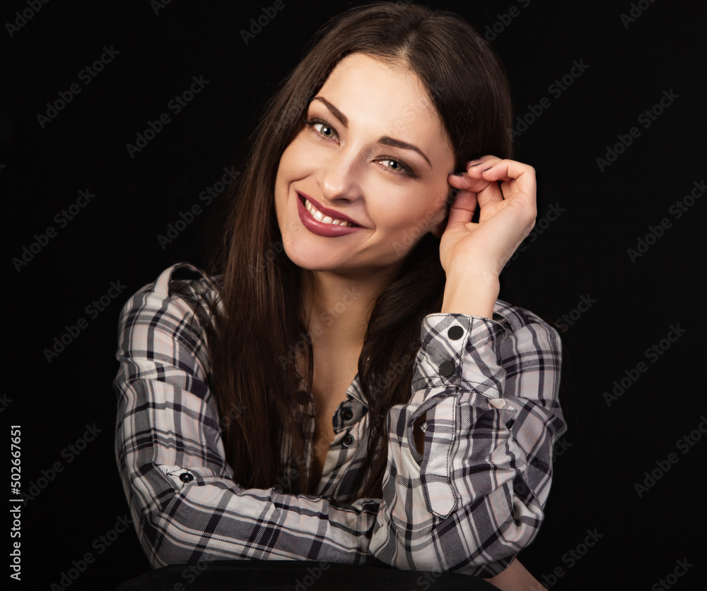 Beautiful happy smiling business woman with toothy smile in plaid shirt on black background with empty copy space. Closeup portrait of natural happiness. Beautiful happy smiling business woman with toothy smile in plaid shirt on black background with empty copy space. Closeup portrait of natural happiness.