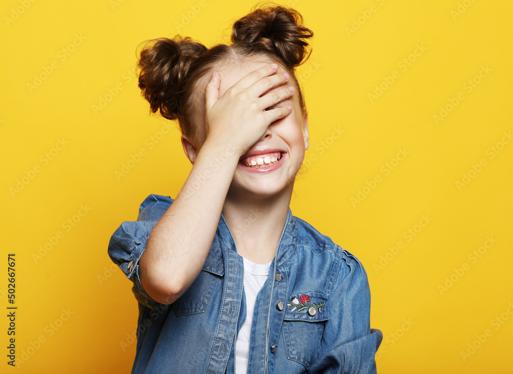 little girl laughs and closes her eyes with her palm little girl laughs and closes her eyes with her palm