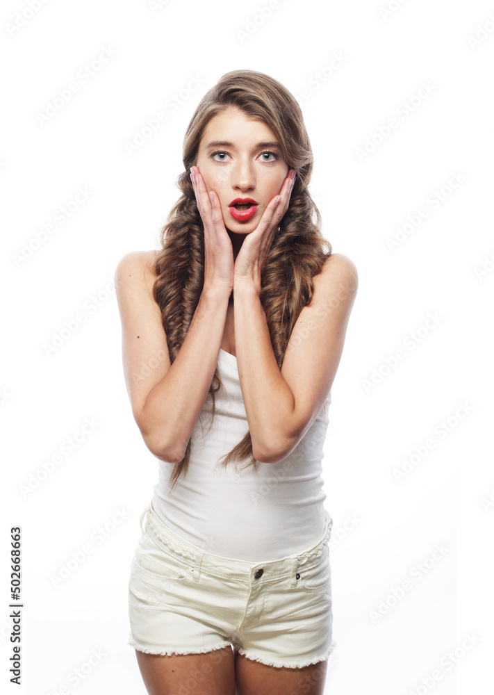 beautiful young woman wearing casual clothes - shorts and shirt posing on white background beautiful young woman wearing casual clothes - shorts and shirt posing on white background
