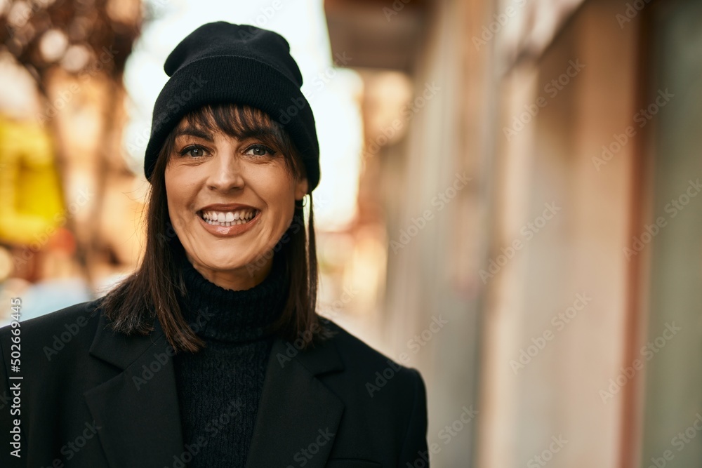 Young hispanic woman smiling happy standing at the city. Young hispanic woman smiling happy standing at the city.