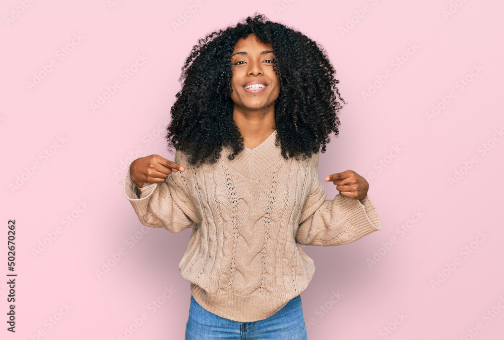 Young african american girl wearing casual clothes looking confident with smile on face, pointing oneself with fingers proud and happy. Young african american girl wearing casual clothes looking confident with smile on face, pointing oneself with fingers proud and happy.