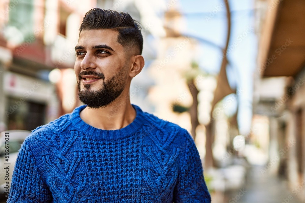 Young arab man smiling confident at street Young arab man smiling confident at street