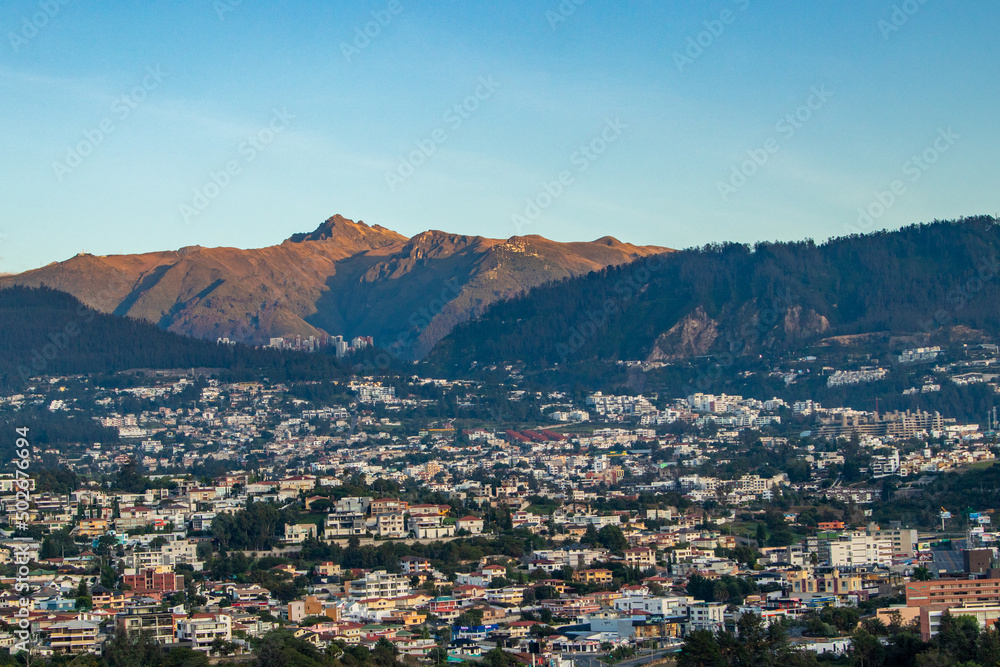 View of the city of Quito and the Rucu Pichincha volcano on a summer morning.