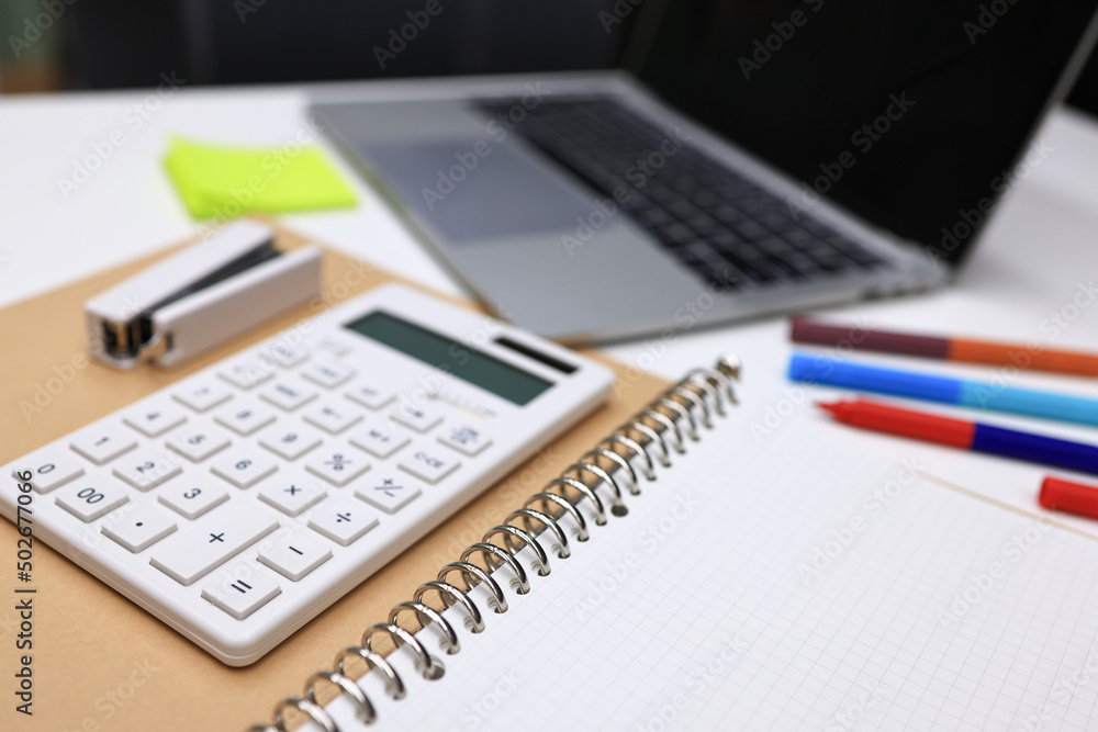 Stationary book pen calculator on white table , office and business article Stationary book pen calculator on white table , office and business article