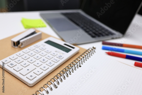 Stationary book pen calculator on white table , office and business article