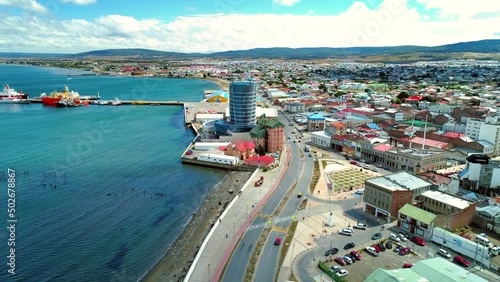 Aerial Forward Shot Of Modern Building In Residential Town By Sea - Punta Arenas, Chile photo