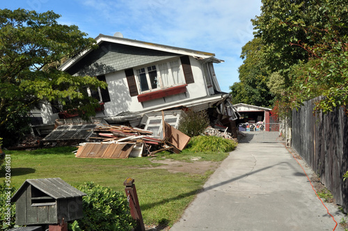 Earthquake - Lower storey of house collapses. photo