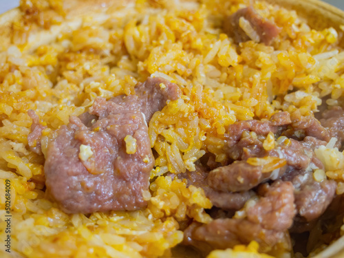 Close up shot of beef with egg Clay Pot Rice