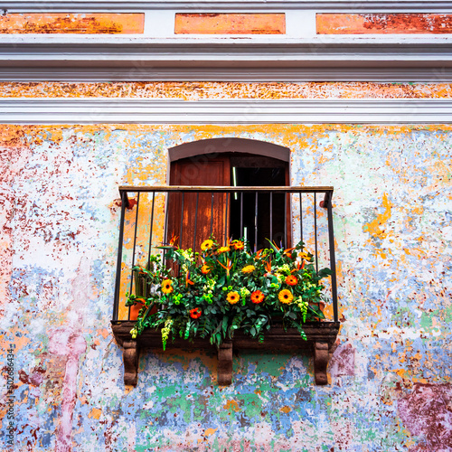 Facade and balcony decorated with flowers