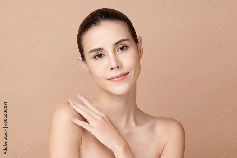 Beautiful young asian woman with clean fresh skin on beige background, Face care, Facial treatment, Cosmetology, beauty and spa, Asian women portrait.