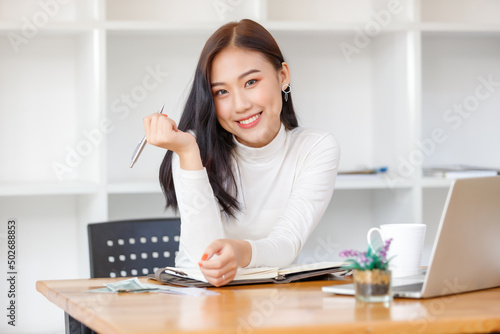 Lifestyle concept, Beautiful asian woman feel relaxing while studying online in coffee shop