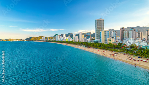 The coastal city of Nha Trang seen from above in the afternoon with its beautiful city and clean sandy beach attracts tourists to visit in Nha Trang, Vietnam