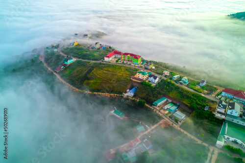 Aerial view of the town in the early morning mist is beautiful in the highlands of Da Lat, Vietnam © huythoai