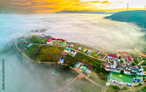 Aerial view of the town mist in the sunrise sky is beautiful in the highlands of Da Lat, Vietnam © huythoai