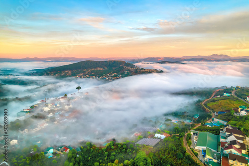 Aerial view of the town mist in the sunrise sky is beautiful in the highlands of Da Lat, Vietnam